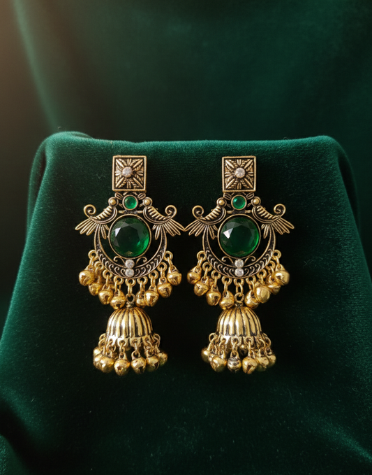 Close-up view of premium artificial Royal Emerald Green & Gold Jhumka Earrings Antique Finish by Innovate Art Impex.
