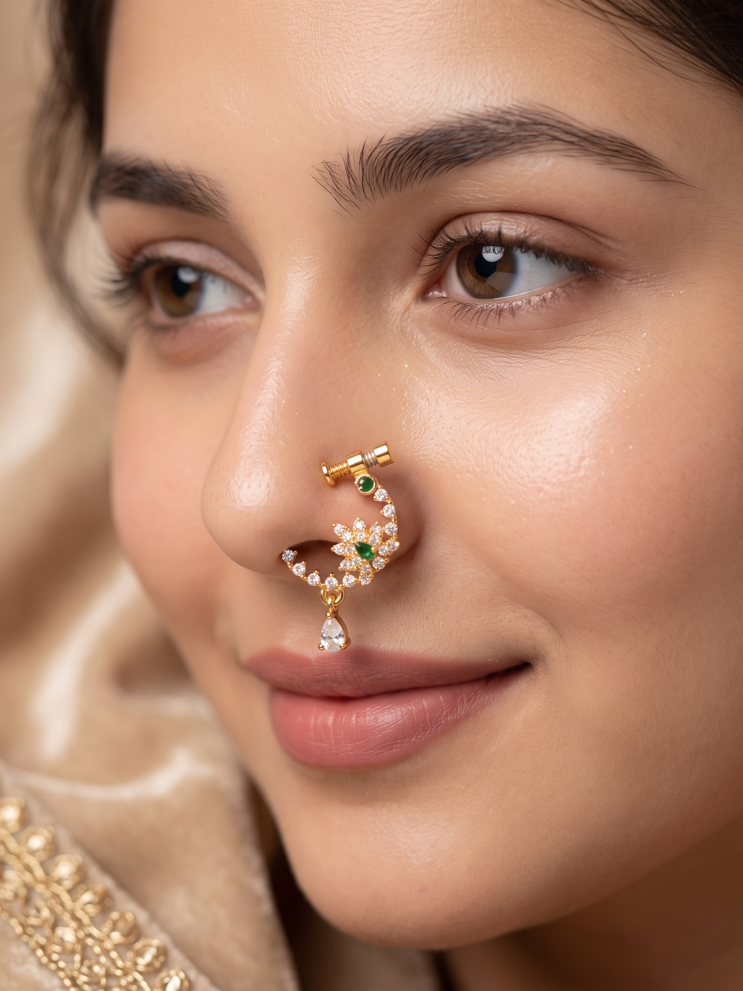 Close-up of a woman's face wearing a decorative nose ring.