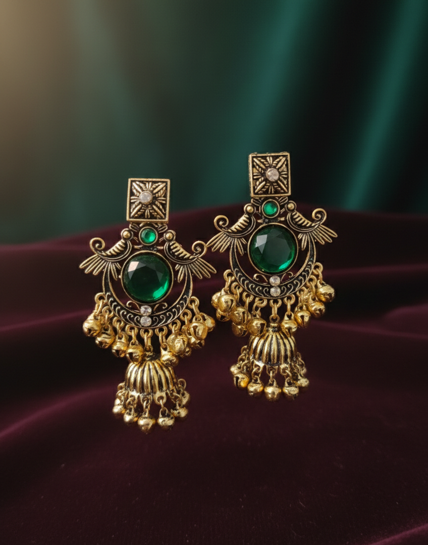 Close-up view of premium artificial Royal Emerald Green & Gold Jhumka Earrings Antique Finish by Innovate Art Impex.