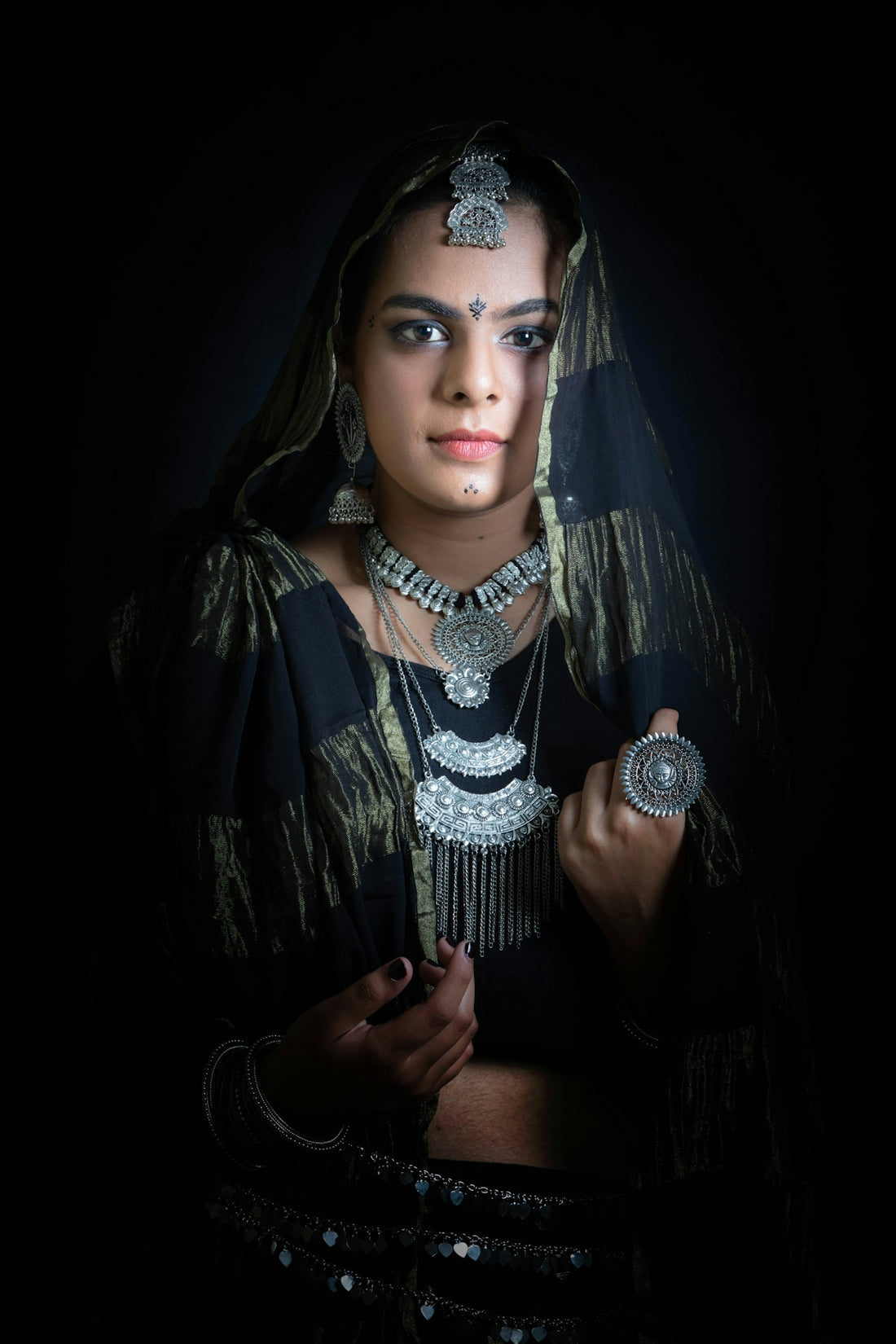 a woman in a black and gold outfit