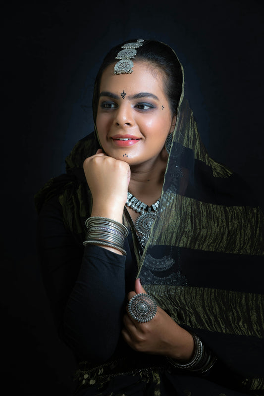 a woman in a sari poses for a picture