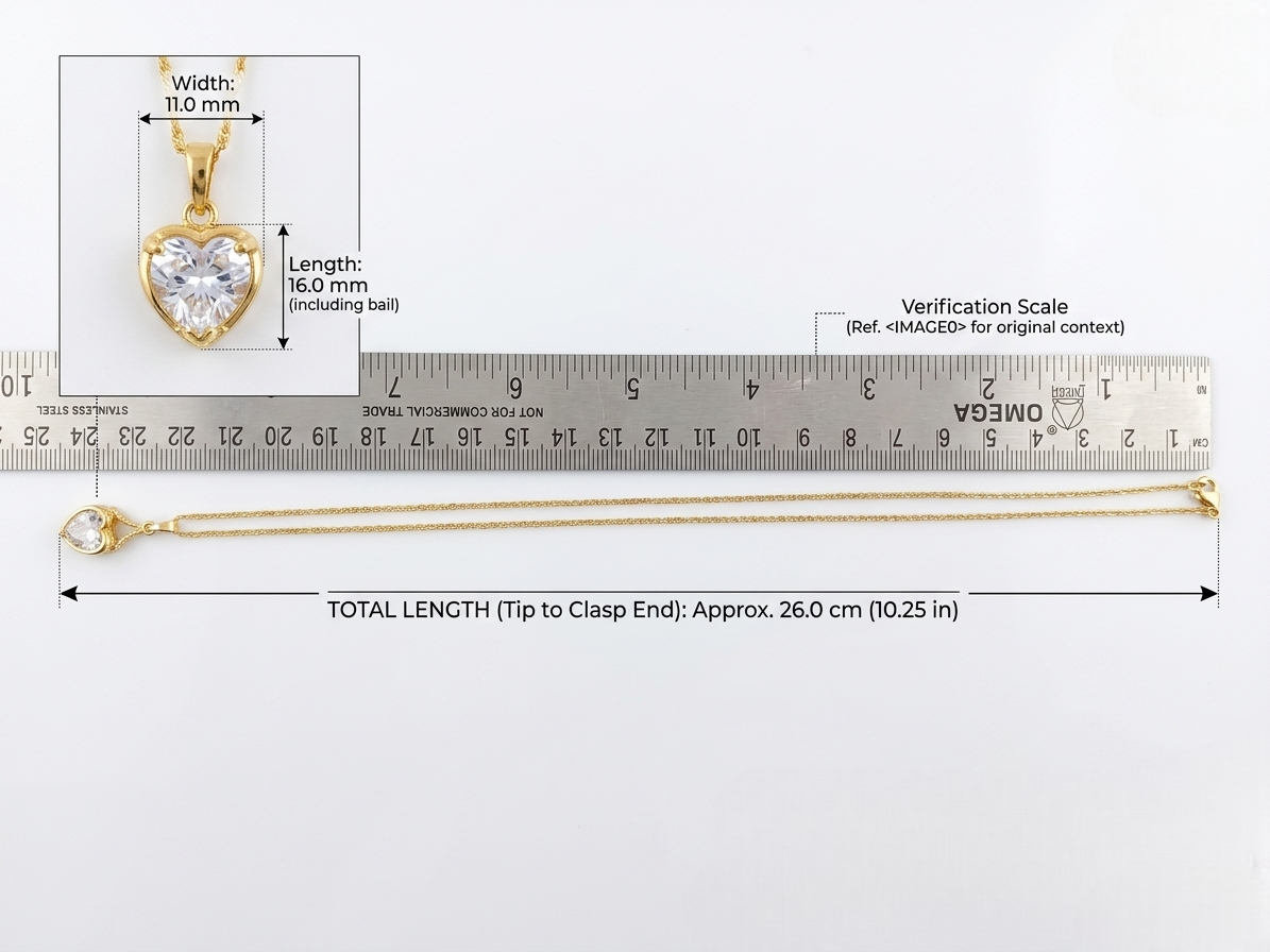 Size dimensions and scale reference for the Vaidika Royal Heritage heart pendant necklace, showing an 11mm by 16mm pendant and a 26cm gold-toned chain next to a measuring ruler.