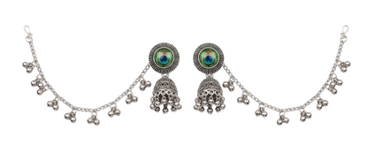 Silver-toned traditional Indian jhumka earrings with a matching chain necklace, featuring round green and blue stone-set studs and dangling bell-shaped jhumkas on a white background.