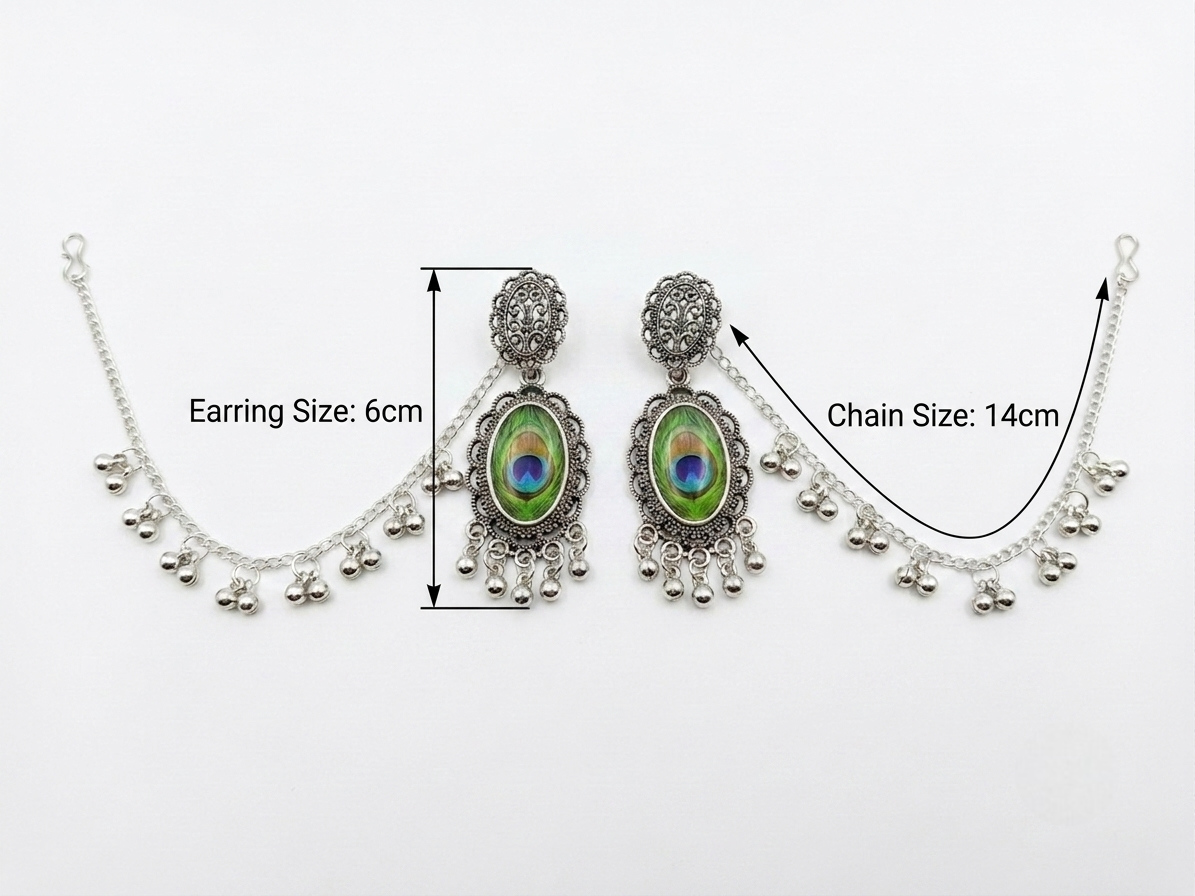 Silver-toned traditional Indian bridal jewelry set featuring a choker necklace and matching drop earrings with peacock feather inlays, annotated with size measurements of 6cm for the earring and 14cm for the chain on a white background.