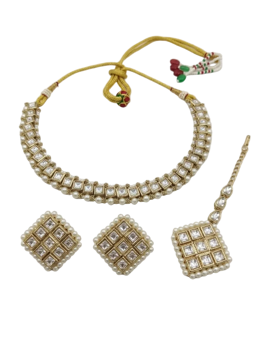 Top-down view of the Vaidika Royal Heritage Kundan choker, earrings, and maang tikka ensemble.