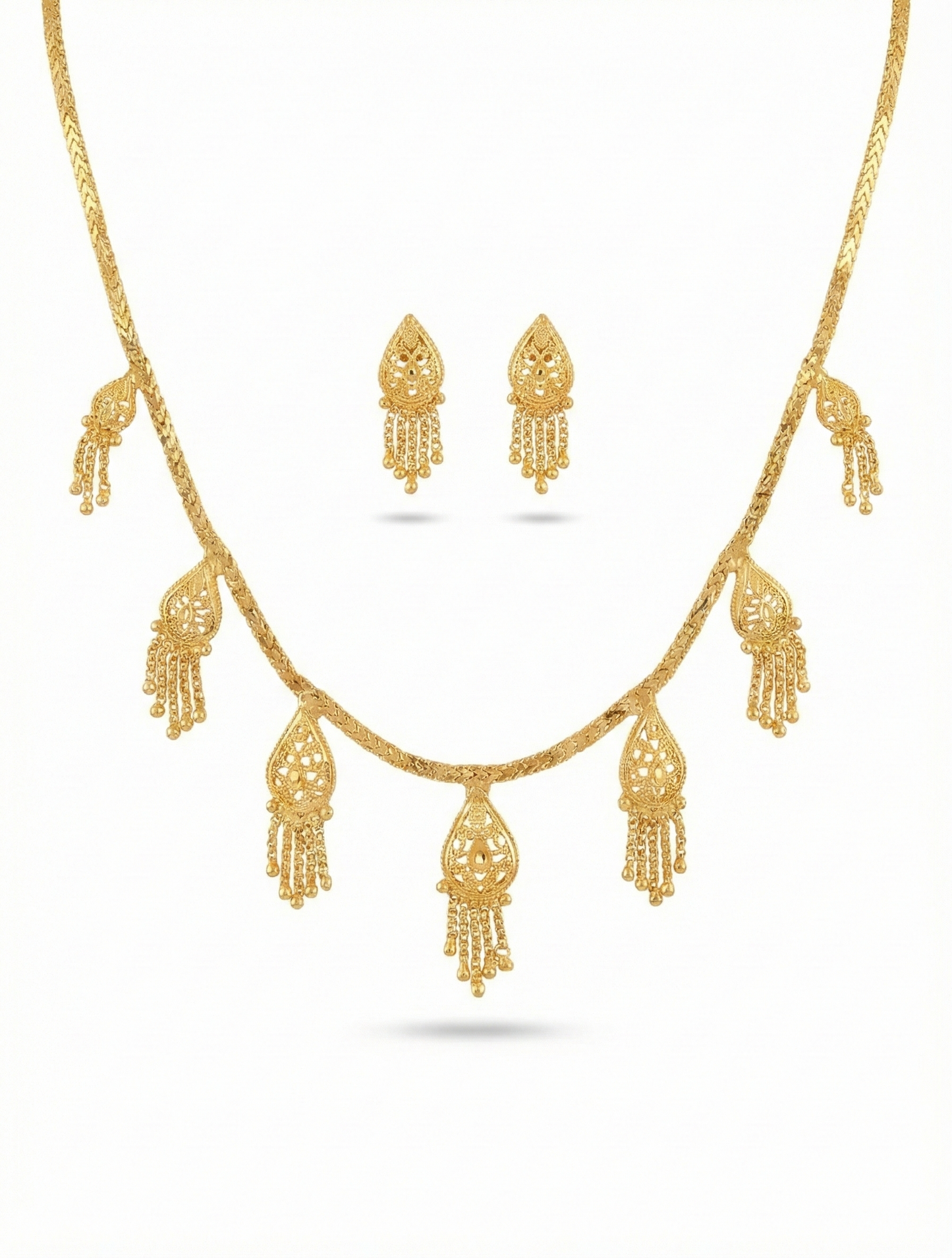Close-up view of premium artificial Innovate Art Impex Gold Finished Filigree Teardrop Necklace with Jhumka Style Dangle Earrings   Ethnic Wedding Party Jwellery for Saree, Lehenga & Girls Dresses by Innovate Art Impex.