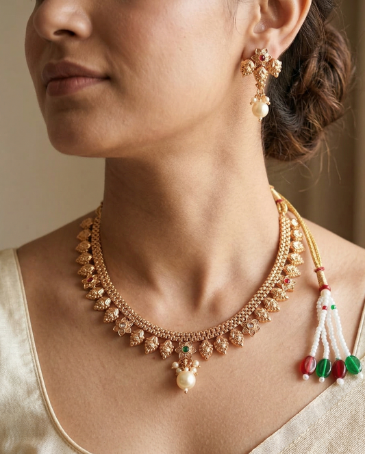 Close-up view of premium artificial Traditional Matte Gold Plated Temple Jewellery Necklace Set with Earrings for Women by Innovate Art Impex.