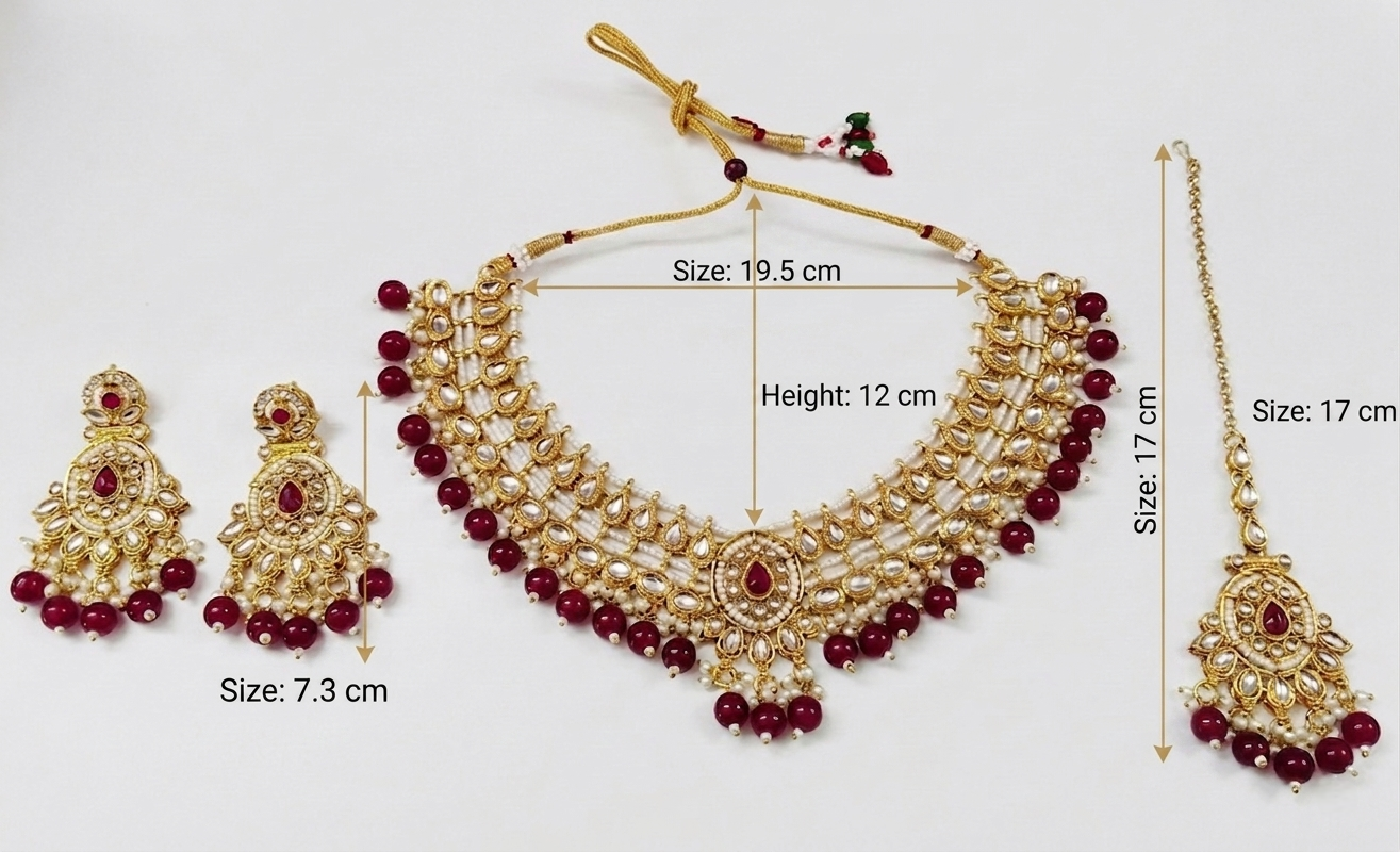 Gold-toned traditional necklace set with matching earrings and maang tikka, decorated with red beads and pearl-like white stones, shown on a white background with size annotations.