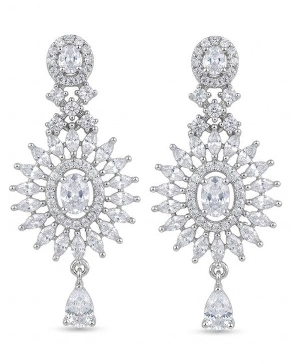 Close-up of a pair of artificial white finish drop earrings featuring a central oval stone, a marquise stone halo, and a bottom teardrop dangle.